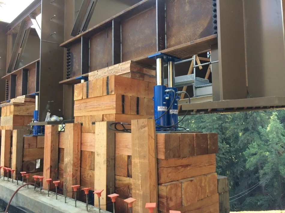 4 pair of 100 ton jacks on each end of the bridge